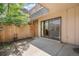 Private back patio with sliding glass door access to the home's interior at 7995 E Mississippi Ave # A4, Denver, CO 80247