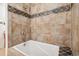 Stylish bathroom features tiled shower/tub with decorative accent at 7995 E Mississippi Ave # A4, Denver, CO 80247