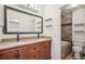 Bathroom boasts a double vanity, granite countertop, and tiled shower/tub at 7995 E Mississippi Ave # A4, Denver, CO 80247