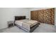Comfortable bedroom with a plush bed, two nightstands, and closet with sliding doors at 7995 E Mississippi Ave # A4, Denver, CO 80247