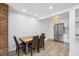 Cozy dining area with stainless appliances and breakfast bar at 7995 E Mississippi Ave # A4, Denver, CO 80247