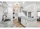 Bright kitchen with white cabinetry, stainless steel appliances, and granite countertops at 7995 E Mississippi Ave # A4, Denver, CO 80247