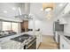 Bright kitchen with white cabinetry, granite countertops, stainless steel appliances, and a large island at 7995 E Mississippi Ave # A4, Denver, CO 80247