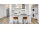 Bright kitchen featuring stainless steel appliances, granite counters, and breakfast bar at 7995 E Mississippi Ave # A4, Denver, CO 80247