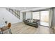 Bright living space with staircase and sliding glass doors to fenced yard at 7995 E Mississippi Ave # A4, Denver, CO 80247