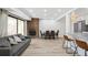 Cozy living space with brick fireplace, dining table, and breakfast bar at 7995 E Mississippi Ave # A4, Denver, CO 80247