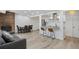 Inviting living area with brick fireplace, dining table, and breakfast bar at 7995 E Mississippi Ave # A4, Denver, CO 80247