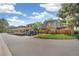 Exterior view of townhouses featuring designated parking and well-maintained lawns at 7995 E Mississippi Ave # A4, Denver, CO 80247