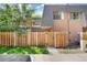Charming townhouse featuring a private, gated front yard and well-maintained exterior at 7995 E Mississippi Ave # A4, Denver, CO 80247