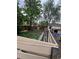 Backyard with a dog house, sheds, and unkempt vegetation at 1900 Quebec St, Denver, CO 80220