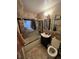 Tiled bathroom including tub, shower, dark vanity, framed mirror, and tiled floors at 1900 Quebec St, Denver, CO 80220