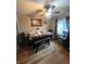 Well-lit dining room featuring a wooden table with bench seating and an overhead ceiling fan at 1900 Quebec St, Denver, CO 80220