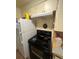 Kitchen with white appliances and cabinets at 1900 Quebec St, Denver, CO 80220