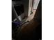 Image shows floor level view into laundry room with exposed plumbing at 1900 Quebec St, Denver, CO 80220