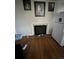 Living room features a fireplace, hardwood floors, and a refrigerator, ready for personal touches at 1900 Quebec St, Denver, CO 80220
