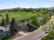 Picturesque home with well-kept lawn and mature trees, backing onto a scenic green space at 14418 W Bayaud Ave, Golden, CO 80401
