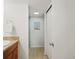 Bathroom featuring earth-toned tile and a glass shower at 14418 W Bayaud Ave, Golden, CO 80401