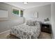 Cozy bedroom with ample light from the corner window and side table with decor at 14418 W Bayaud Ave, Golden, CO 80401
