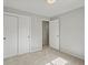 Neutral bedroom with double closet, and doorway to other rooms at 14418 W Bayaud Ave, Golden, CO 80401