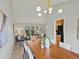 Open concept dining room showcases modern chandelier and bright living area at 14418 W Bayaud Ave, Golden, CO 80401