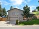 Beautiful brick home with a well-maintained lawn, offering a welcoming curb appeal at 14418 W Bayaud Ave, Golden, CO 80401