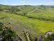 Vast green landscape with rolling hills, offering endless outdoor recreation opportunities at 14418 W Bayaud Ave, Golden, CO 80401