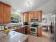 Well-lit kitchen with stainless steel appliances and backyard view at 14418 W Bayaud Ave, Golden, CO 80401