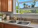 Kitchen sink with a view to a scenic backyard at 14418 W Bayaud Ave, Golden, CO 80401