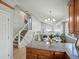 Open concept floorplan with stairway, dining area, and kitchen at 14418 W Bayaud Ave, Golden, CO 80401
