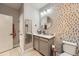 Modern bathroom featuring a vanity with storage, updated fixtures, and stylish mirror at 1831 S Dunkirk St # 103, Aurora, CO 80017