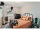 Bright bedroom features a large window, dresser, and comfortable bed with decorative pillows at 1831 S Dunkirk St # 103, Aurora, CO 80017
