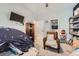 bedroom showcases play area with tent, comfortable chair, and well-organized storage at 1831 S Dunkirk St # 103, Aurora, CO 80017