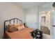 Cozy bedroom boasts a sliding closet and a comfortable bed dressed with decorative pillows at 1831 S Dunkirk St # 103, Aurora, CO 80017
