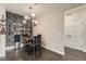 Cozy breakfast nook with table and chairs, featuring stylish wallpaper and shelving at 1831 S Dunkirk St # 103, Aurora, CO 80017