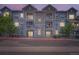 Charming apartment building with grey stone and white trim, offering a modern living space at 1831 S Dunkirk St # 103, Aurora, CO 80017