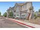 Well-maintained apartment complex with stone accents, landscaping, and multiple units at 1831 S Dunkirk St # 103, Aurora, CO 80017