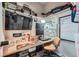 Cozy home office features a large monitor, workstation, and ample storage space at 1831 S Dunkirk St # 103, Aurora, CO 80017