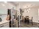 Bright kitchen and breakfast nook featuring stainless steel appliances and updated cabinets at 1831 S Dunkirk St # 103, Aurora, CO 80017