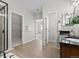 Bathroom with double vanity and access to a walk-in closet at 6918 S Riverwood Way, Aurora, CO 80016