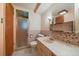 Retro bathroom with a shower, patterned tile and a pink sink at 7077 Dudley Dr, Arvada, CO 80004