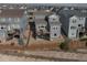 Aerial view of backyards with wooden fences, decks, and patios for outdoor enjoyment at 15076 W 93Rd Ave, Arvada, CO 80007