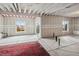 Unfinished basement with concrete flooring, exposed ceiling, and bright windows for natural light at 15076 W 93Rd Ave, Arvada, CO 80007