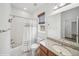 Bathroom featuring shower-tub combination, granite countertop and natural light at 15076 W 93Rd Ave, Arvada, CO 80007