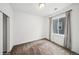 A modern bedroom with plush carpet and a window at 15076 W 93Rd Ave, Arvada, CO 80007