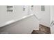 A bright staircase featuring carpet steps and white walls at 15076 W 93Rd Ave, Arvada, CO 80007
