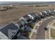 A wide view of a residential street with well-maintained homes and landscaping at 15076 W 93Rd Ave, Arvada, CO 80007