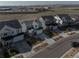 Scenic street view of multiple homes in a suburban community, showcasing consistent architecture and well-maintained landscaping at 15076 W 93Rd Ave, Arvada, CO 80007