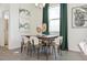 Inviting dining area with stylish chairs, a wooden table, and decorative elements at 1356 S Boston Ct # B, Denver, CO 80247