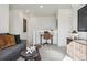 Stylish living room area with comfortable gray sectional and built-in desk, perfect for relaxing and work at 1356 S Boston Ct # B, Denver, CO 80247