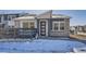 Charming two-story home featuring a modern exterior design with stone accents and a welcoming front entrance at 2491 W 69Th Pl, Denver, CO 80221